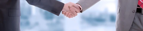A handshake to begin a new business partnership