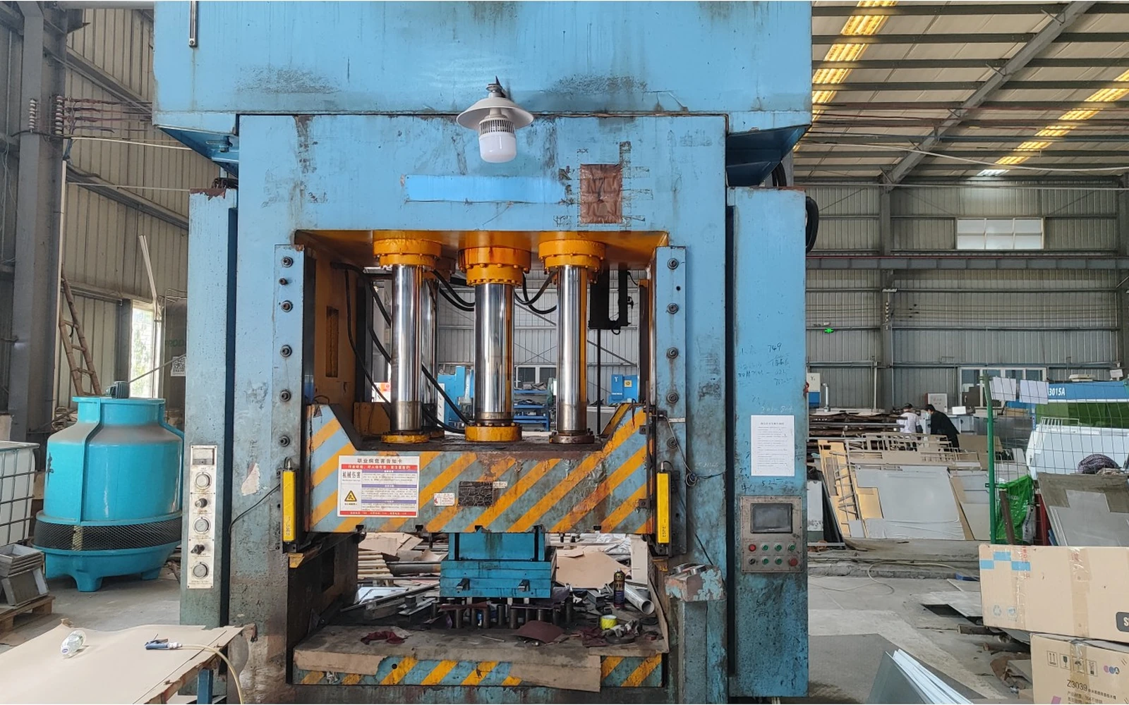 Large hydraulic press in the Roosa stamping workshop