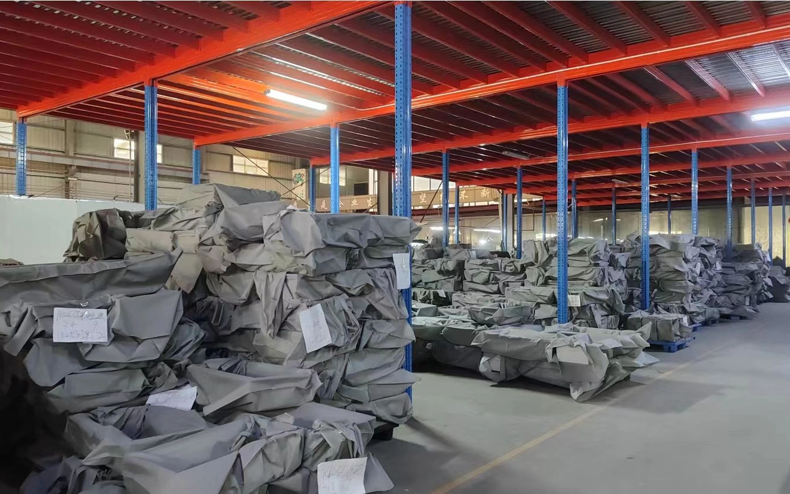 Shelving and wrapped semi-finished products in the factory warehouse